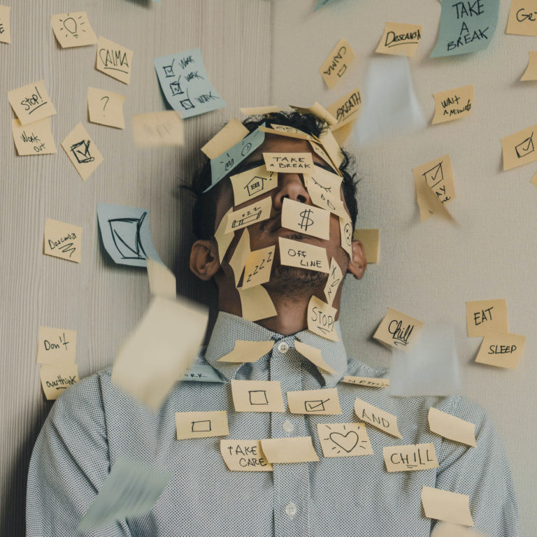 Anxiety: Man covered in post it notes