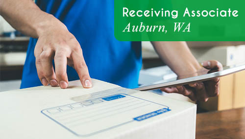 Image shows a person holding a clipboard and handling a small clipboard. Now Hiring a Receiving Associate in Auburn, WA!