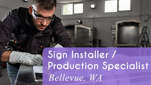 Image shows a man working on a sign at a table. Now Hiring a Sign Fabricator in Bellevue, WA