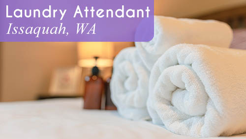 Image shows folded towels on a bed in a hotel room. Now Hiring a Laundry Attendant in Issaquah, WA