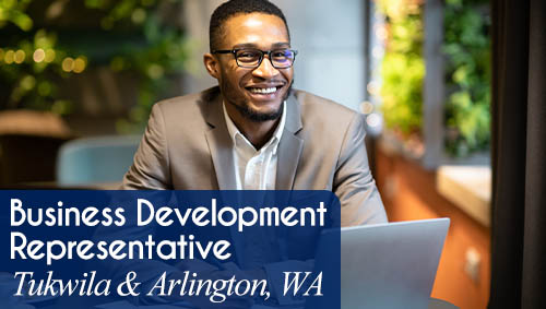 Image shows a smiling business man working at a computer. Now Hiring a Business Development Representative in Tukwila & Arlington, WA. All StarZ Staffing.
