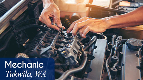 Image shows hands working on a vehicle. Now hiring a Mechanic in Tukwila, WA. All StarZ Staffing.