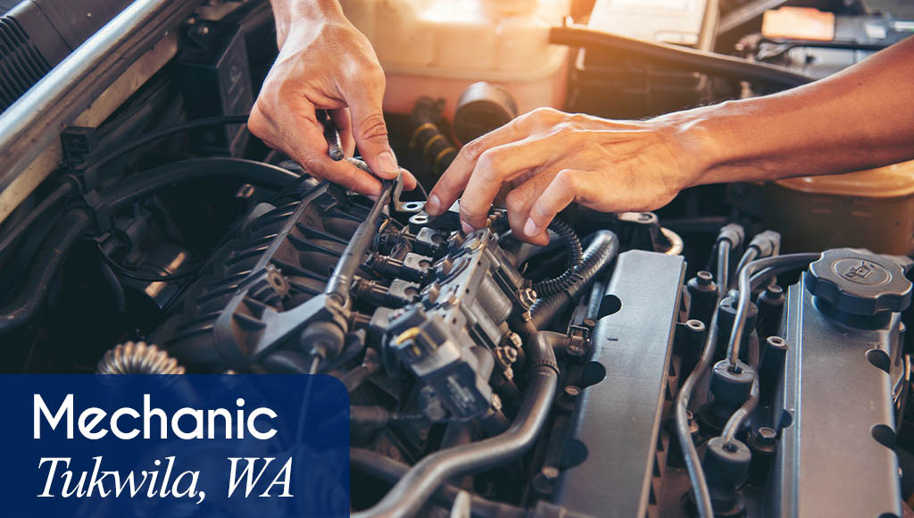 Image shows hands working on a vehicle. Now hiring a Mechanic in Tukwila, WA. All StarZ Staffing.