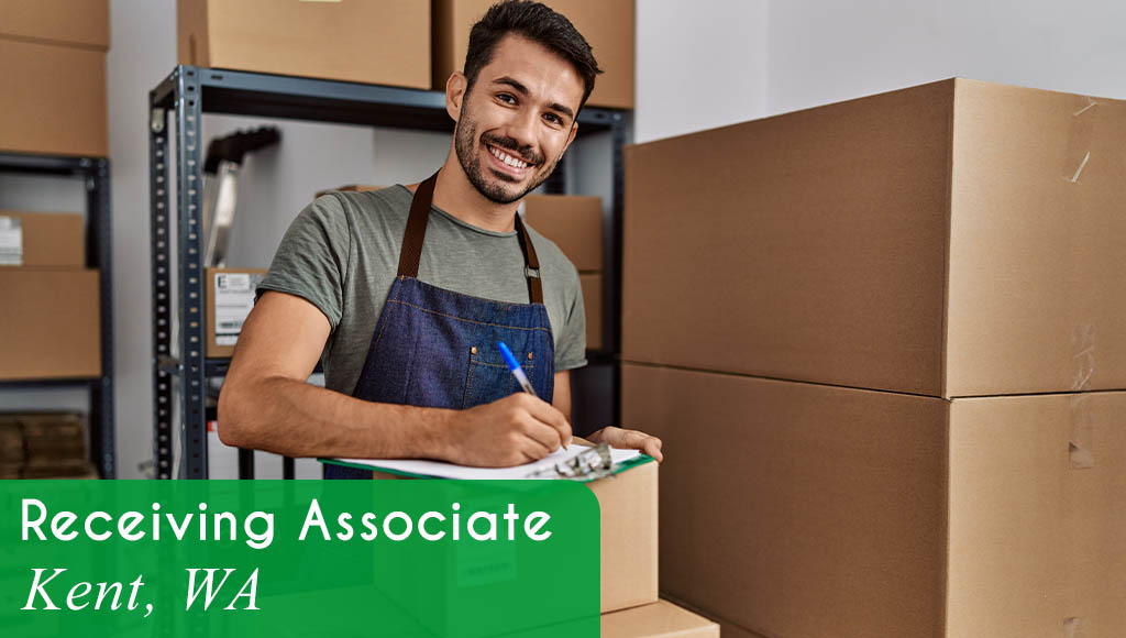 Image shows a man smiling and writing on a clipboard. Boxes are stacked in the background. Now Hiring a Receiving Associate in Kent, WA. All StarZ Staffing.