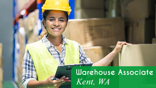 Image shows a woman wearing a hard hat and safety vest. She is holding a clipboard in a warehouse setting. Now Hiring a Warehouse Associate in Kent, WA.