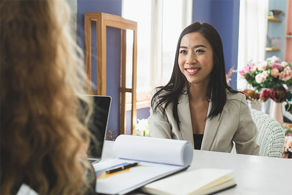 Image shows a female job seeker working with a career counselor