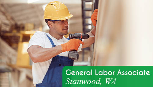 Image showsa smiling man wearing protective gear and using a hand drill. Text reads: Now hiring a General Labor Associate in Stanwood, WA. All StarZ Staffing.