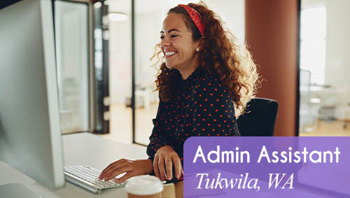 Image shows a smiling woman working at a computer in an office setting. Text reads: Now hiring an Administrative Assistant in Tukwila, WA. All StarZ Staffing.