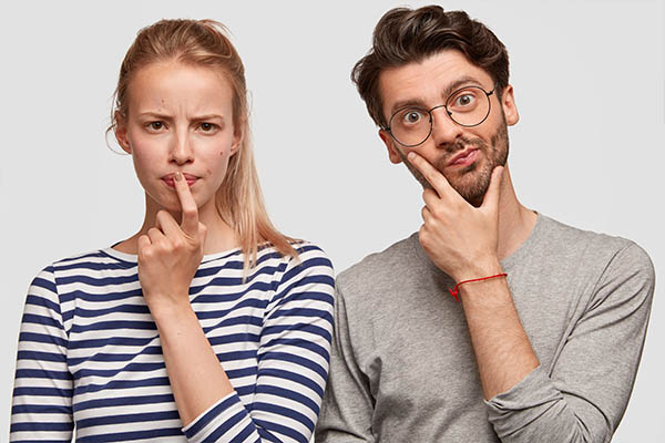 Image shows a man and woman with puzzled expressions