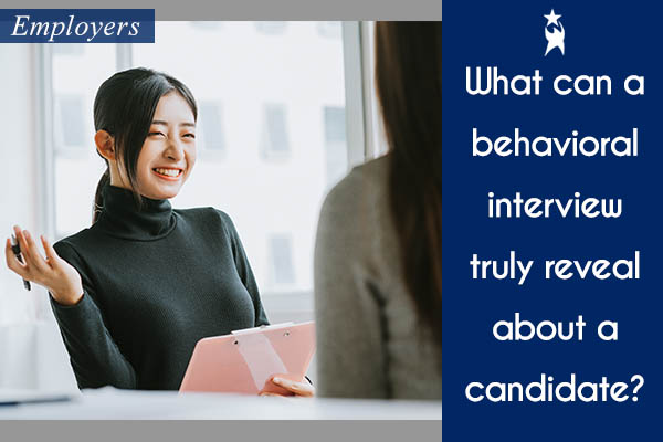 Image shows a smiling woman responding to a question in an interview. Text reads: What can a behavioral interview truly reveal about a candidate? All StarZ Staffing.